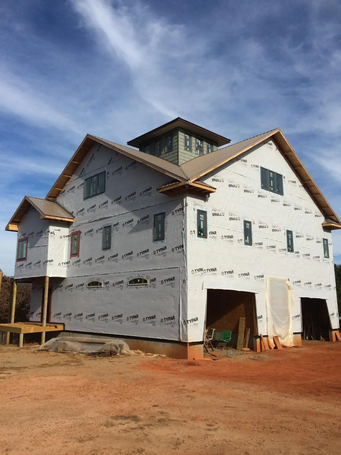 New two story house under construction with a cupola and gabled roofs in Martinsburg